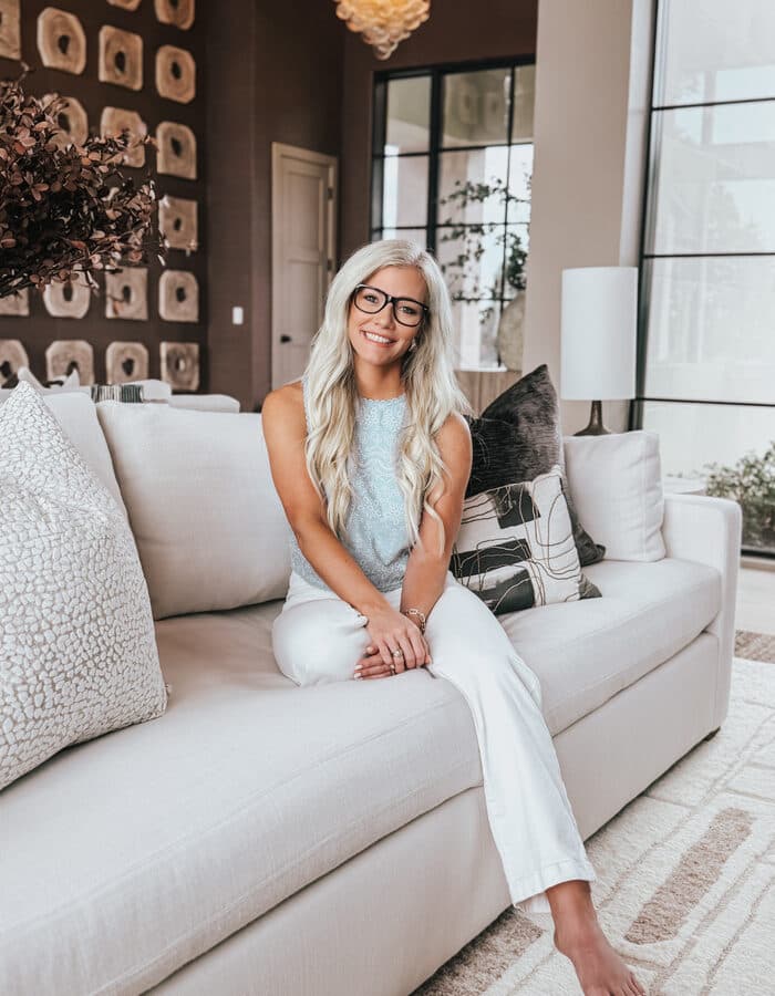 Denise Donoghue, the Mortgage Nerd, seated on a couch